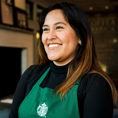 Picture of TreeHouse alum, Angie, at work in a Starbucks apron