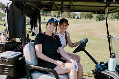 Women in a golf cart